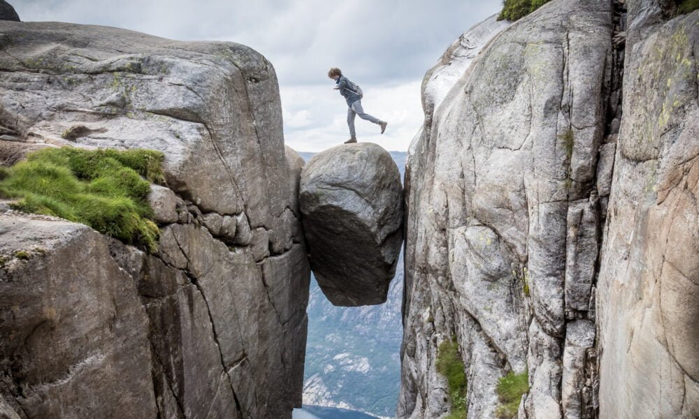 person standing on Kjeragbolten