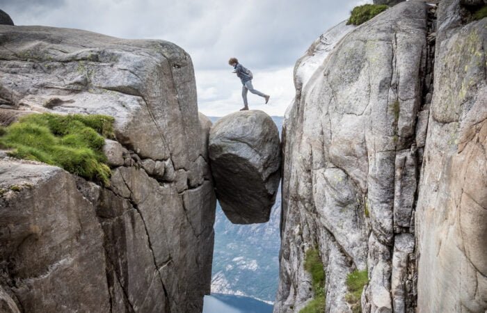 person standing on Kjeragbolten