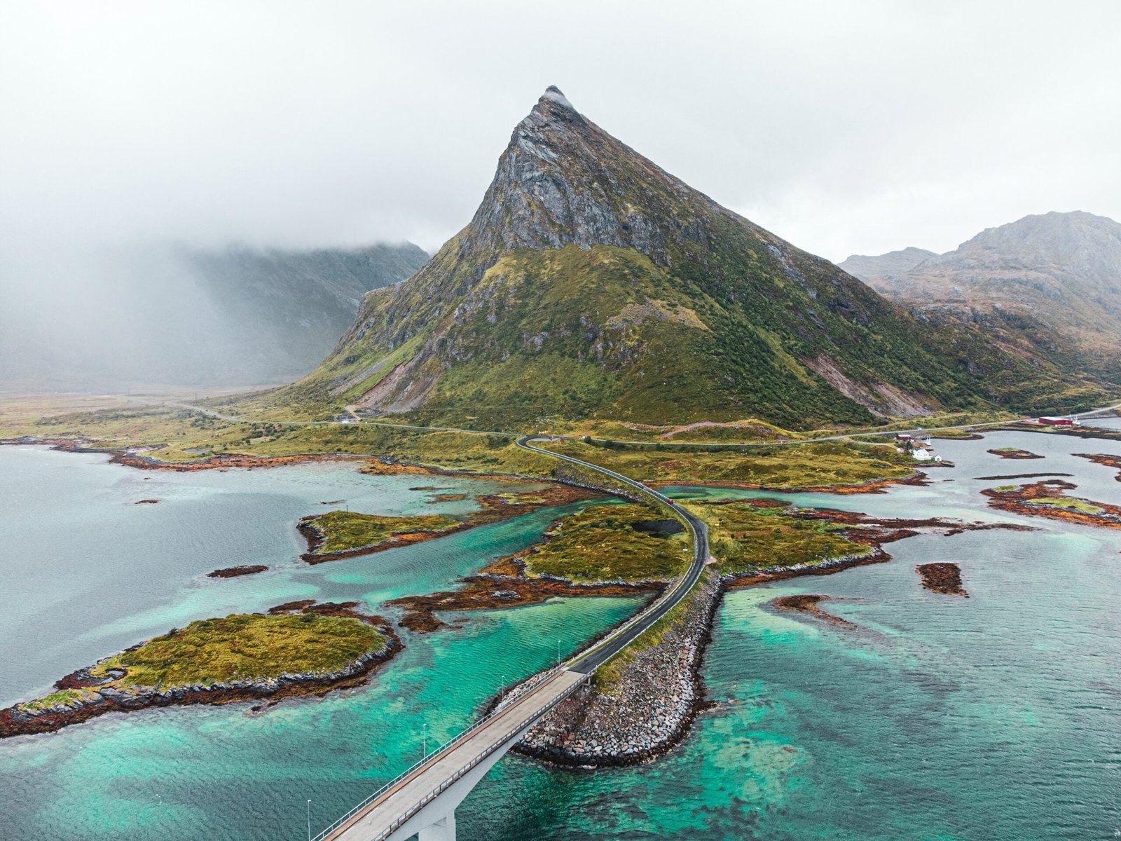 norwegian mountain with rain cloud next to it